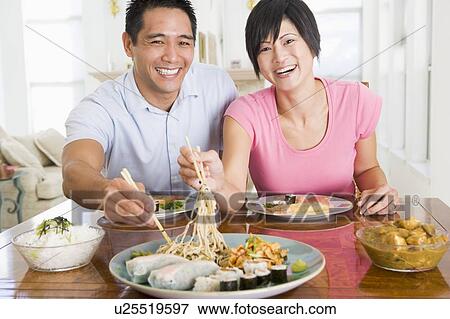 Stock Photo - Young Couple Enjoying Chinese Food. Fotosearch