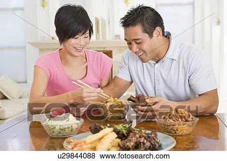 Young Couple Enjoying Chinese Food View Large Photo Image Stock Photo - Young Couple Enjoying Chinese Food. Fotosearch