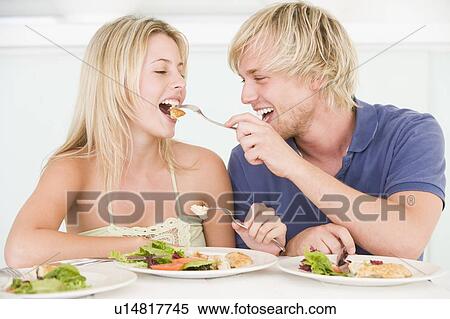 Young Couple Enjoying meal, mealtime Together View Large Photo Image Stock Photography - Young Couple Enjoying meal, mealtime Together. Fotosearch