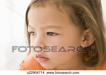 Picture - Young girl indoors. Fotosearch