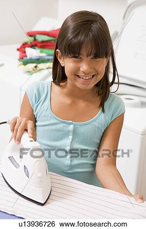 Stock Photograph - Young Girl Ironing . Fotosearch