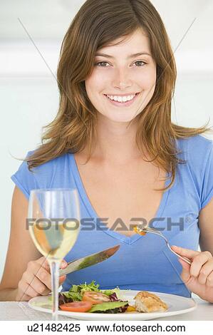 Young Woman Enjoying meal, mealtime With A Glass Of Wine View Large Photo Image Stock Photography - Young Woman Enjoying meal, mealtime With A Glass Of Wine. Fotosearch