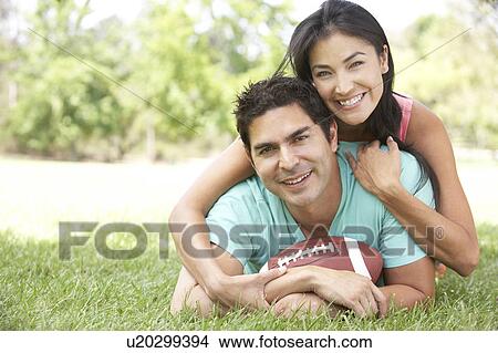 Couple In Park With American Football View Large Photo Image Picture - Couple In Park With American Football. Fotosearch