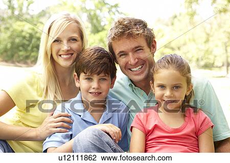 Stock Image - Family Enjoying Day In Park. Fotosearch