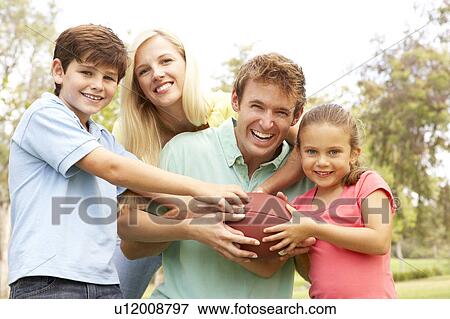 Family Playing American Football Together In Park View Large Photo Image Stock Photo - Family Playing American Football Together In Park. Fotosearch