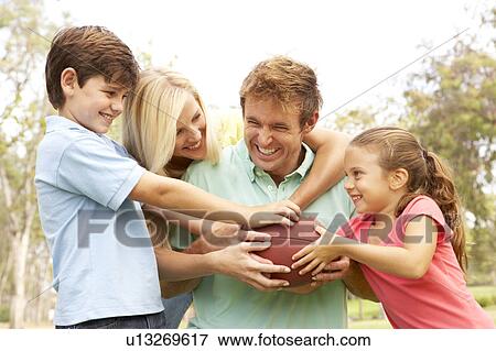 Family Playing American Football Together In Park View Large Photo Image Stock Photo - Family Playing American Football Together In Park. Fotosearch