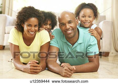 Family Relaxing At Home Together View Large Photo Image Picture - Family Relaxing At Home Together. Fotosearch