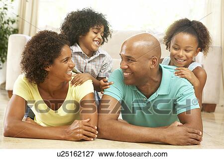 Family Relaxing At Home Together View Large Photo Image Stock Photo - Family Relaxing At Home Together. Fotosearch