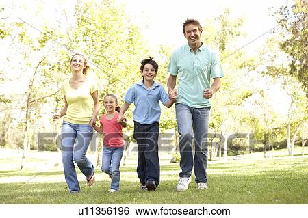 Family Running In Park View Large Photo Image Stock Photograph - Family Running In Park. Fotosearch
