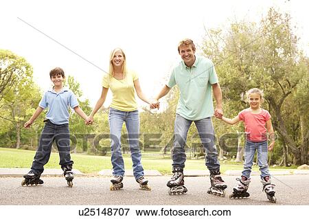 Stock Photo - Family Wearing In Line Skates In Park. Fotosearch