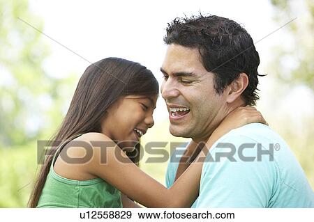 Stock Photo - Father And Daughter In Park. Fotosearch