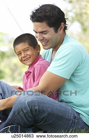 Stock Image - Father And Son In Park. Fotosearch