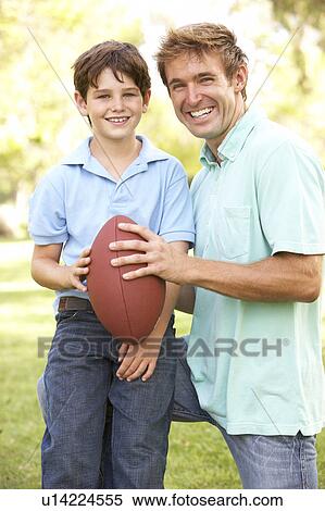 Father And Son Playing American Football Together View Large Photo Image Stock Photography - Father And Son Playing American Football Together. Fotosearch