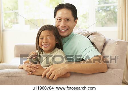 Father And Son Relaxing At Home View Large Photo Image Picture - Father And Son Relaxing At Home. Fotosearch