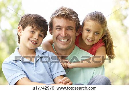 Stock Photograph - Father With Children In Park. Fotosearch