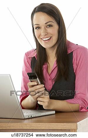 Female Businesswoman Using Laptop At Desk View Large Photo Image Picture - Female Businesswoman Using Laptop At Desk. Fotosearch