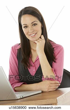 Female Businesswoman Using Laptop At Desk View Large Photo Image Stock Image - Female Businesswoman Using Laptop At Desk. Fotosearch