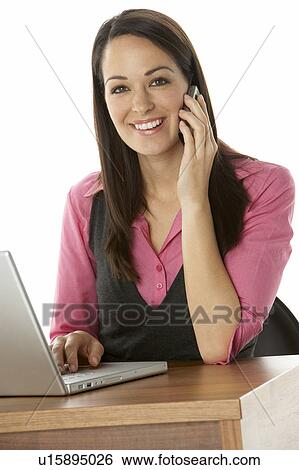 Female Businesswoman Using Laptop At Desk View Large Photo Image Stock Photograph - Female Businesswoman Using Laptop At Desk. Fotosearch
