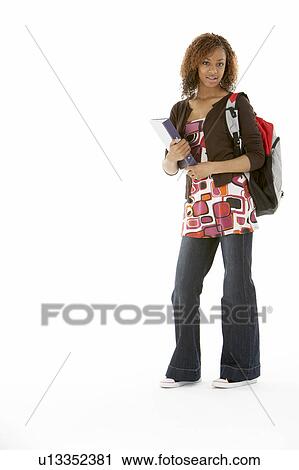 Stock Image - Full Length Studio Portrait Of Female Teenage Student. Fotosearch