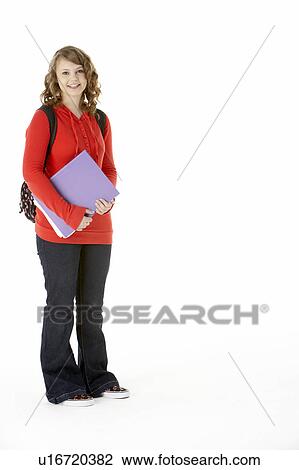 Stock Image - Full Length Studio Portrait Of Female Teenage Student. Fotosearch