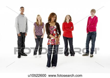 Stock Image - Full Length Studio Portrait Of Five Teenage Friends. Fotosearch