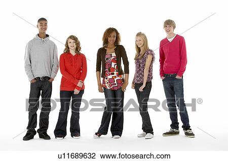 Stock Image - Full Length Studio Portrait Of Five Teenage Friends. Fotosearch