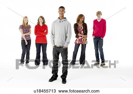 Stock Image - Full Length Studio Portrait Of Five Teenage Friends. Fotosearch