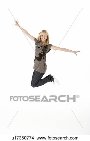 Full Length Studio Portrait Of Jumping Teenage Girl View Large Photo Image Picture - Full Length Studio Portrait Of Jumping Teenage Girl. Fotosearch