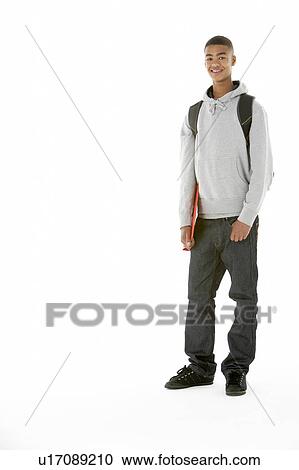 Stock Image - Full Length Studio Portrait Of Male Teenage Student. Fotosearch