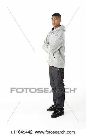 Stock Image - Full Length Studio Portrait Of Teenage Boy. Fotosearch