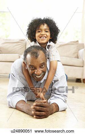 Grandfather And Grandson Playing Together At Home View Large Photo Image Stock Image - Grandfather And Grandson Playing Together At Home. Fotosearch