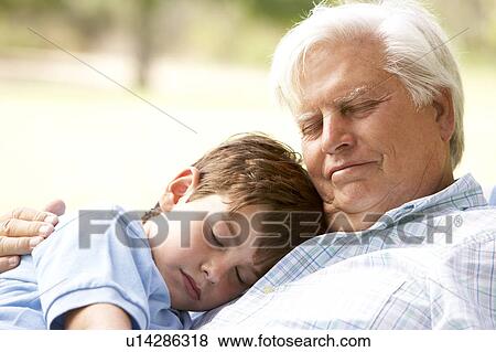 Grandfather And Grandson Taking Nap Together View Large Photo Image Stock Photo - Grandfather And Grandson Taking Nap Together. Fotosearch