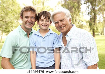 Stock Photograph - Grandfather With Father And Son In Park. Fotosearch