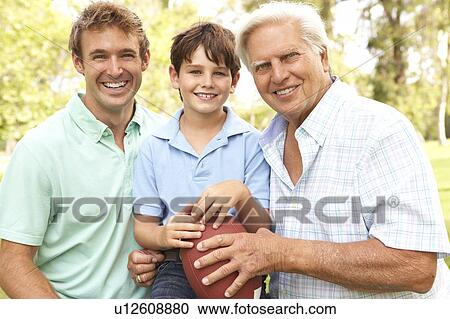 Stock Image - Grandfather With Father And Son Playing American Football Together. Fotosearch