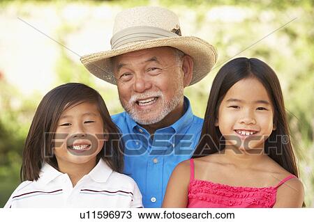 Grandfather With Granddaughters In Garden View Large Photo Image Stock Image - Grandfather With Granddaughters In Garden. Fotosearch