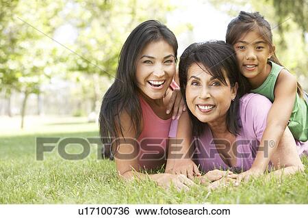 Stock Photograph - Grandmother With Daughter And Granddaughter In Park. Fotosearch