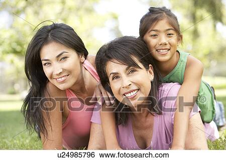 Stock Photograph - Grandmother With Daughter And Granddaughter In Park. Fotosearch