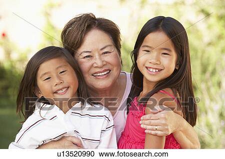 Grandmother With Granddaughters In Garden View Large Photo Image Stock Image - Grandmother With Granddaughters In Garden. Fotosearch
