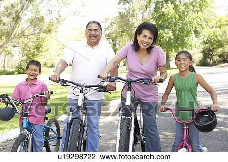 Grandparents In Park With Grandchildren Riding Bikes View Large Photo Image Stock Image - Grandparents In Park With Grandchildren Riding Bikes. Fotosearch