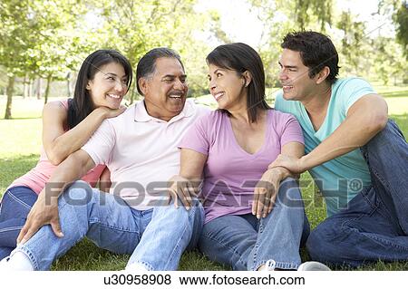 Grandparents With Adult Children In Park View Large Photo Image Stock Photo - Grandparents With Adult Children In Park. Fotosearch