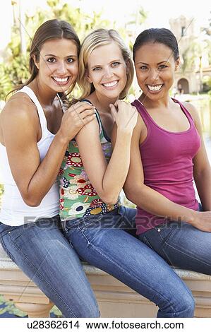 Picture - Group Of Three Female Friends Having Fun Together. Fotosearch
