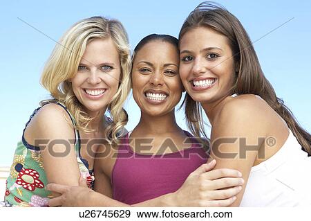 Stock Photo - Group Of Three Female Friends Having Fun Together. Fotosearch