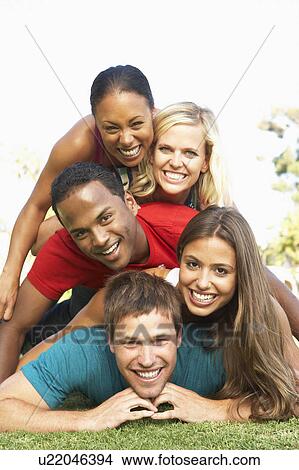 Picture - Group Of Young Friends Having Fun Together. Fotosearch