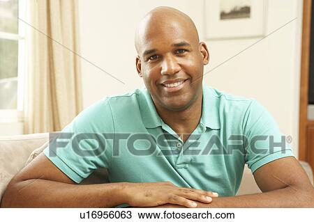 Man Relaxing On Sofa At Home View Large Photo Image Stock Image - Man Relaxing On Sofa At Home. Fotosearch
