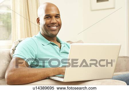 Man Using Laptop At Home View Large Photo Image Stock Photography - Man Using Laptop At Home. Fotosearch