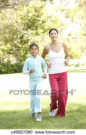 Mother And Daughter Exercising In Park View Large Photo Image Stock Image - Mother And Daughter Exercising In Park. Fotosearch