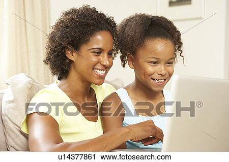 Mother And Daughter Using Laptop At Home View Large Photo Image Stock Image - Mother And Daughter Using Laptop At Home. Fotosearch