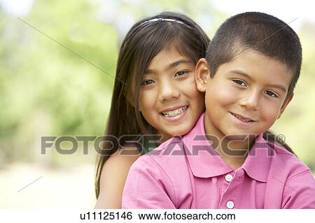 Portrait Of Brother And Sister In Park View Large Photo Image Stock Photograph - Portrait Of Brother And Sister In Park. Fotosearch