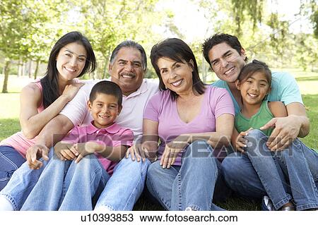 Stock Image - Portrait Of Extended Family Group In Park. Fotosearch