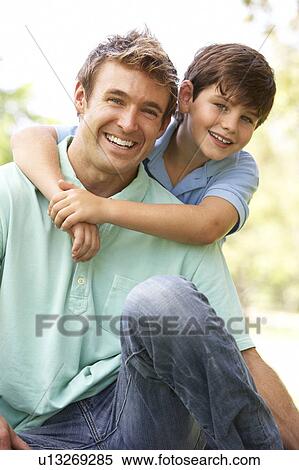 Portrait Of Father And Son In Park View Large Photo Image Stock Photography - Portrait Of Father And Son In Park. Fotosearch